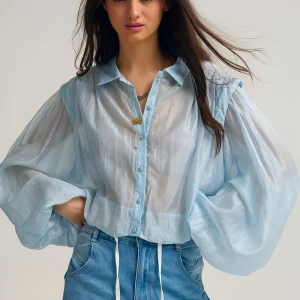 Chemisier en soie Tencel bleu avec manches ballon et boutons en nacar